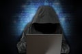 Unrecognizable hacker in front of computer Ã¢â¬â cyber crime concept